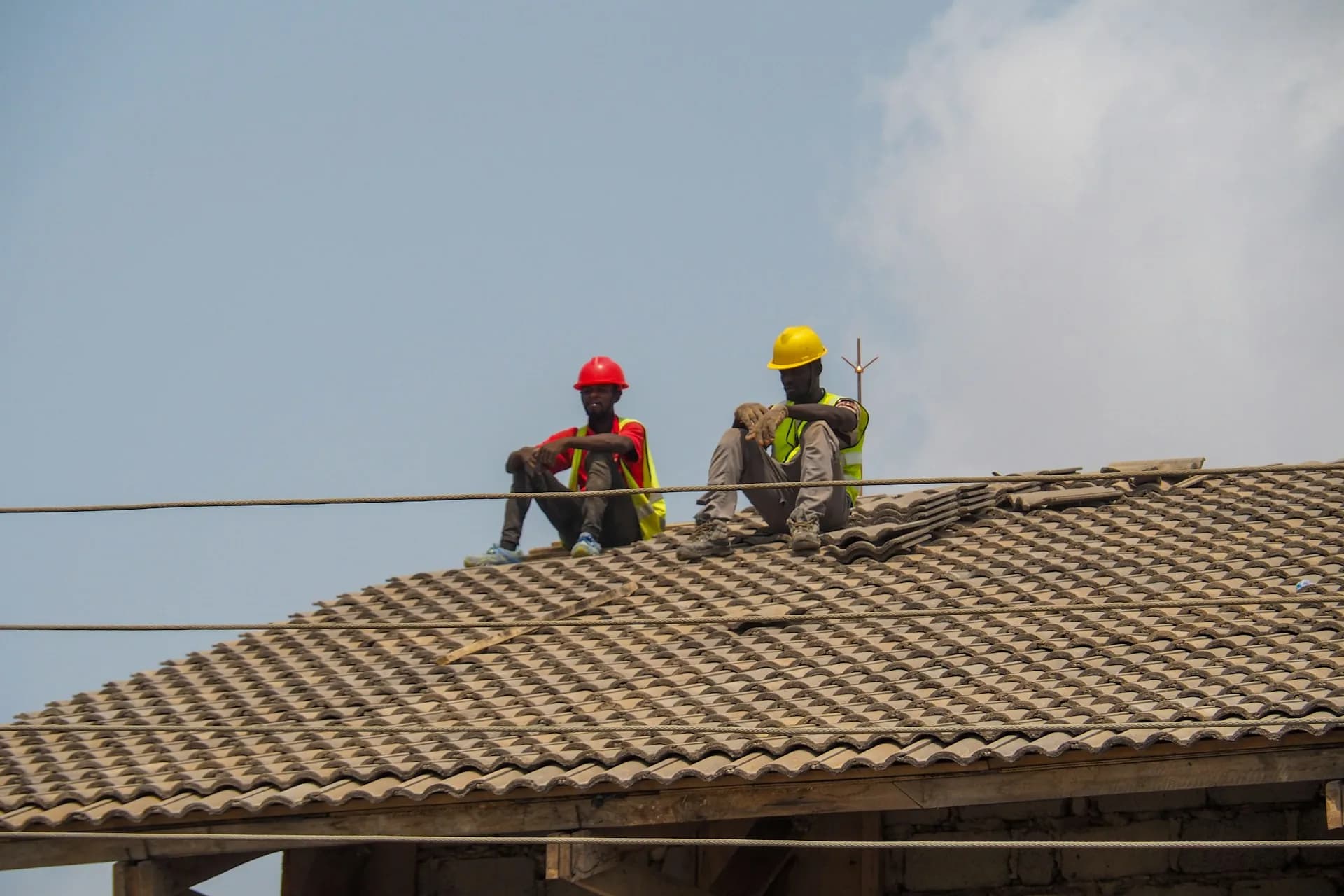 Installers training on a solar panel roof install