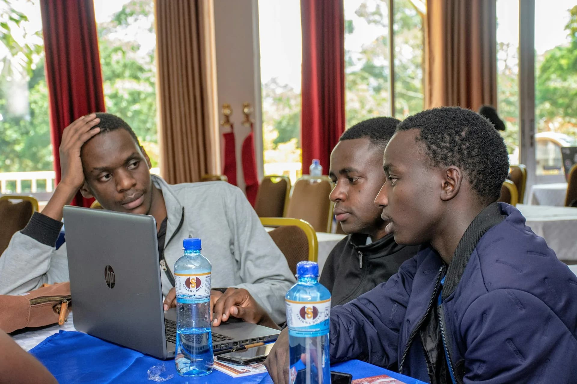 Installers training together on laptops